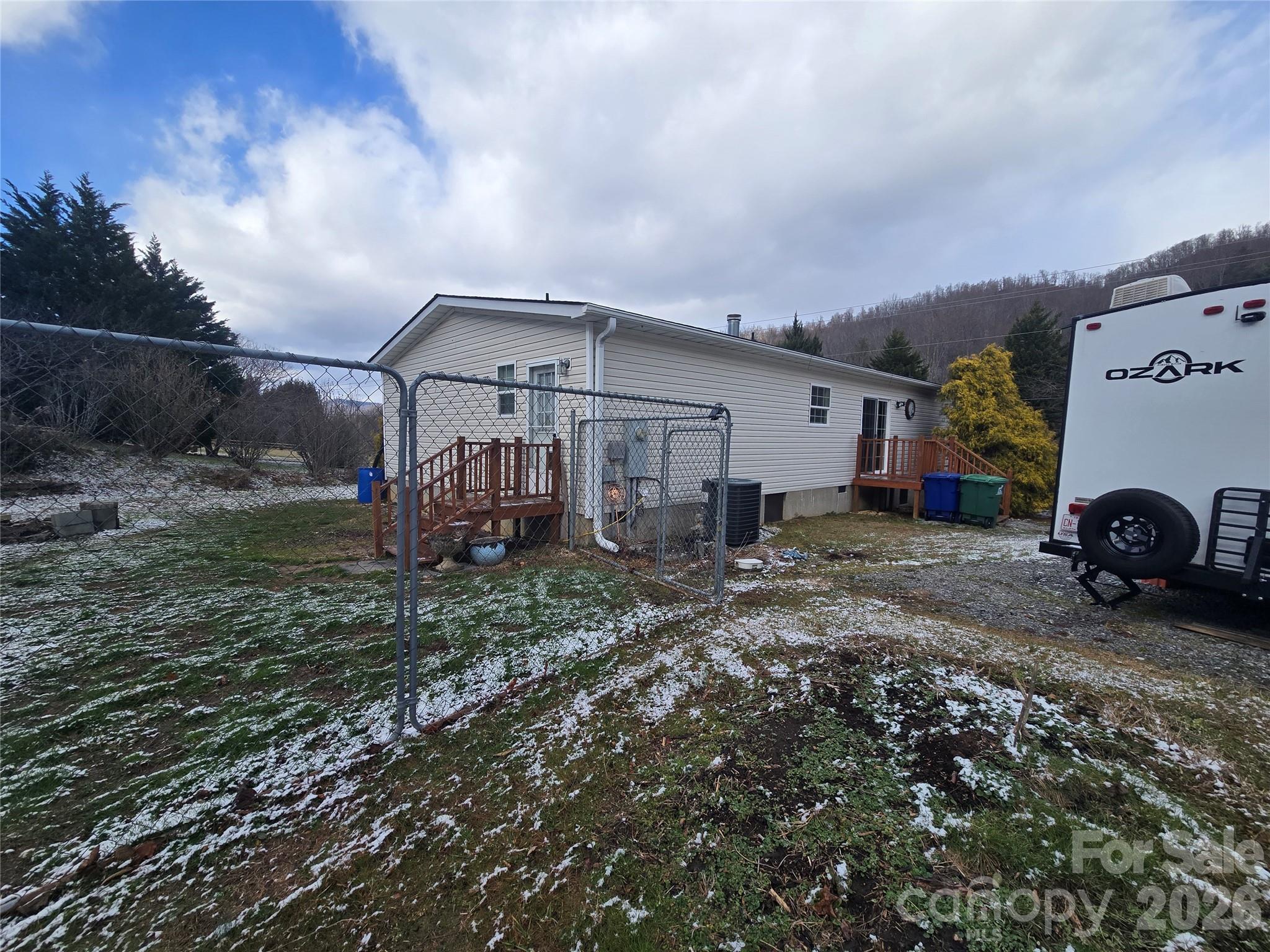703 Garren Creek Road Fairview, NC 28730 - Photo 47 of 48 a view of a house with a backyard