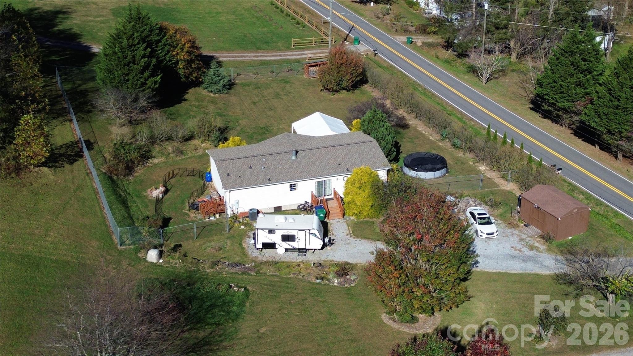 703 Garren Creek Road Fairview, NC 28730 - Photo 6 of 48 an aerial view of a house with a yard