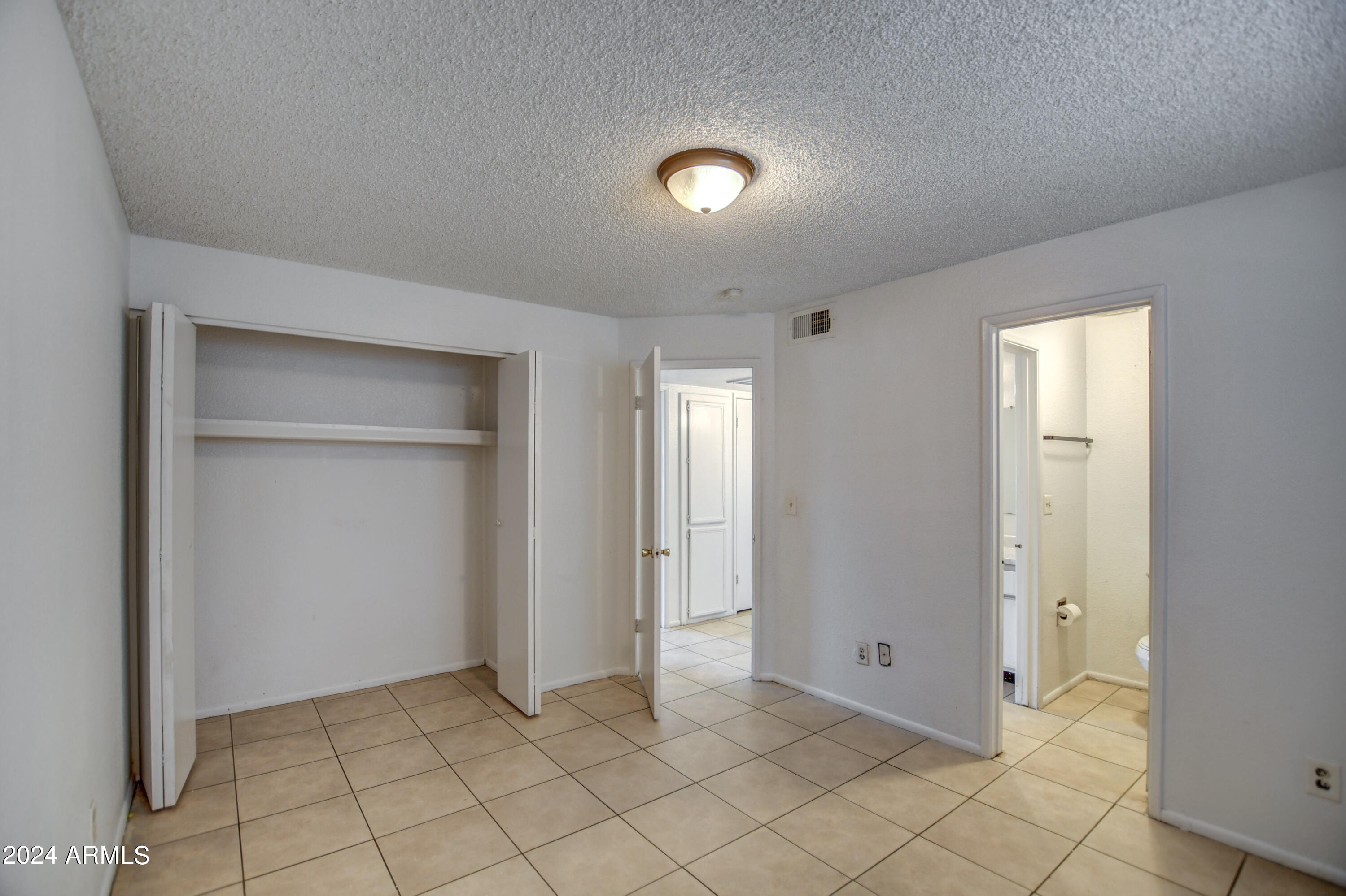 6711 West Osborn Road, Unit 19 Phoenix, AZ 85033 - Photo 17 of 24 Primary Bed 2