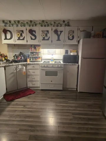 a kitchen with a stove and cabinets