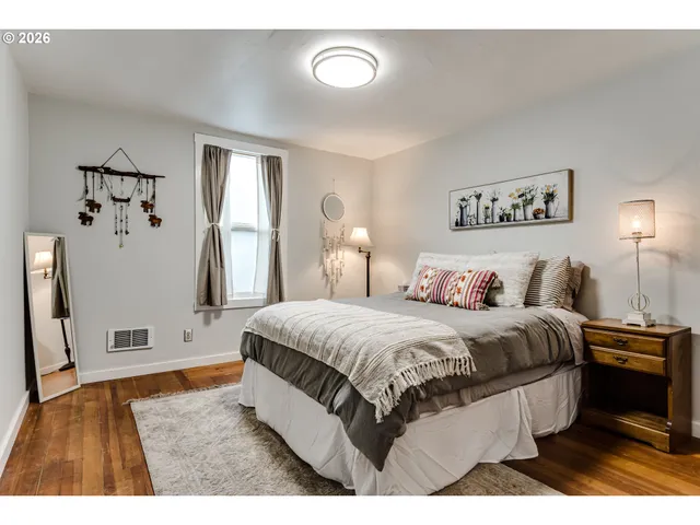 a spacious bedroom with a bed and a walk in closet
