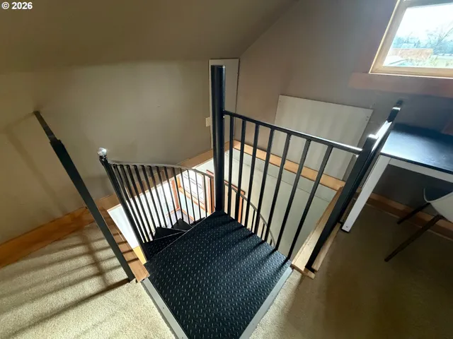 a view of staircase with wooden floor