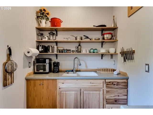 a kitchen with a stove and cabinets