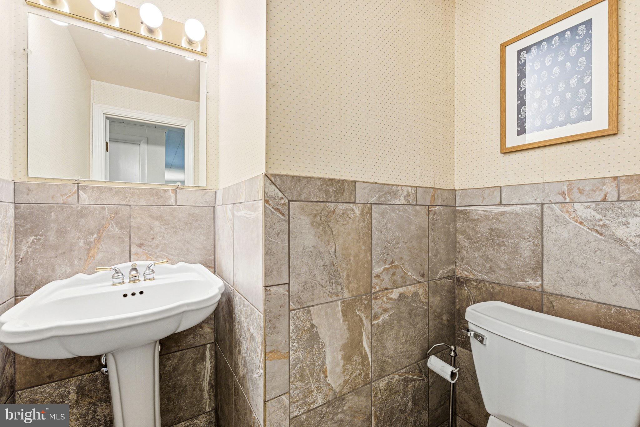 210 Cooper Drive Wallingford, PA 19086 - Photo 20 of 47 a bathroom with a sink a toilet and shower