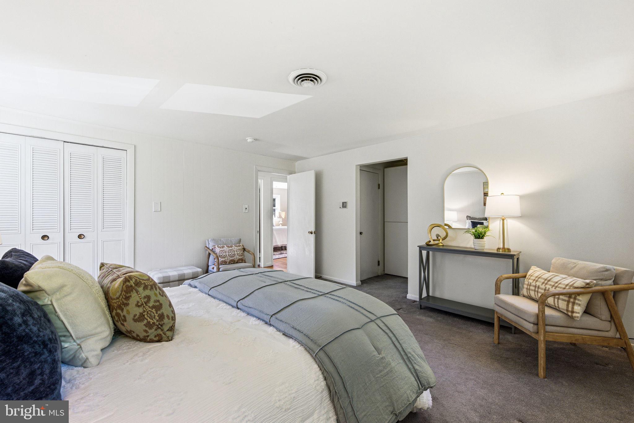 210 Cooper Drive Wallingford, PA 19086 - Photo 22 of 47 a bedroom with a bed and a dresser