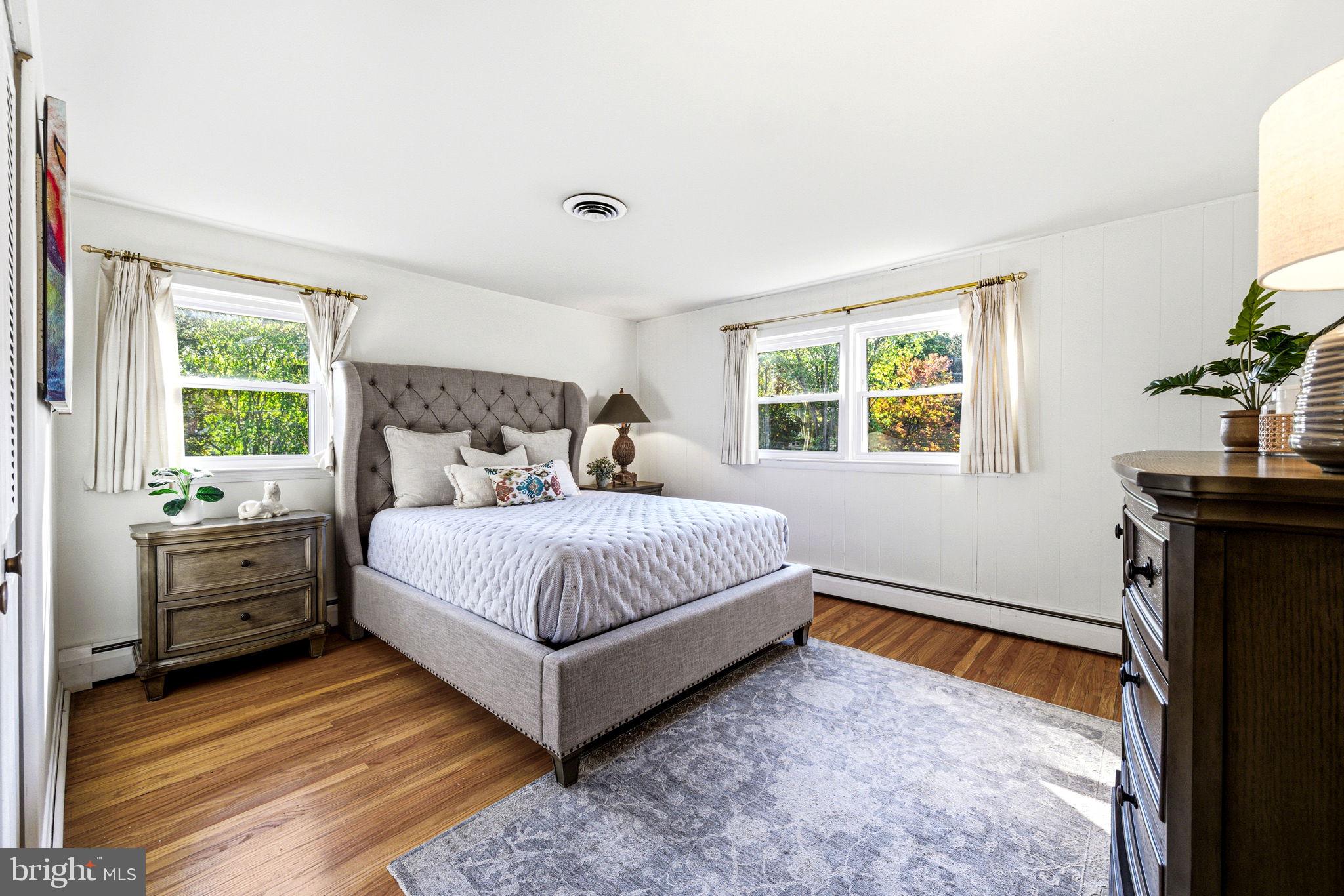 210 Cooper Drive Wallingford, PA 19086 - Photo 24 of 47 a bedroom with a bed and a window