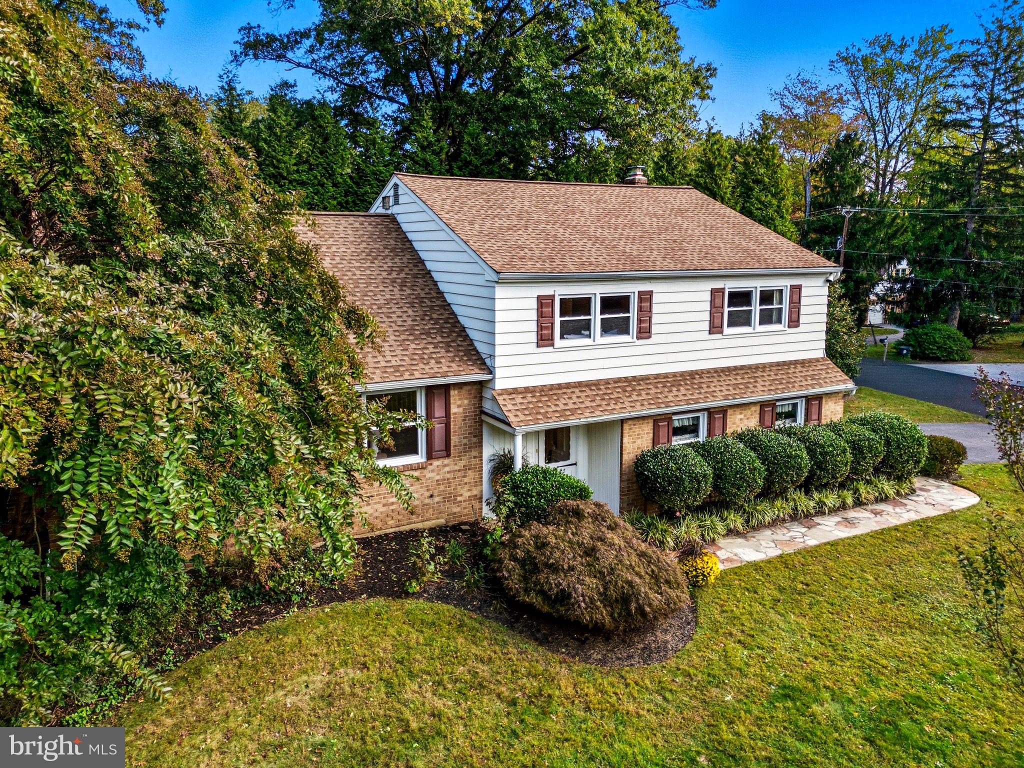 210 Cooper Drive Wallingford, PA 19086 - Photo 3 of 47 front view of a house with a yard