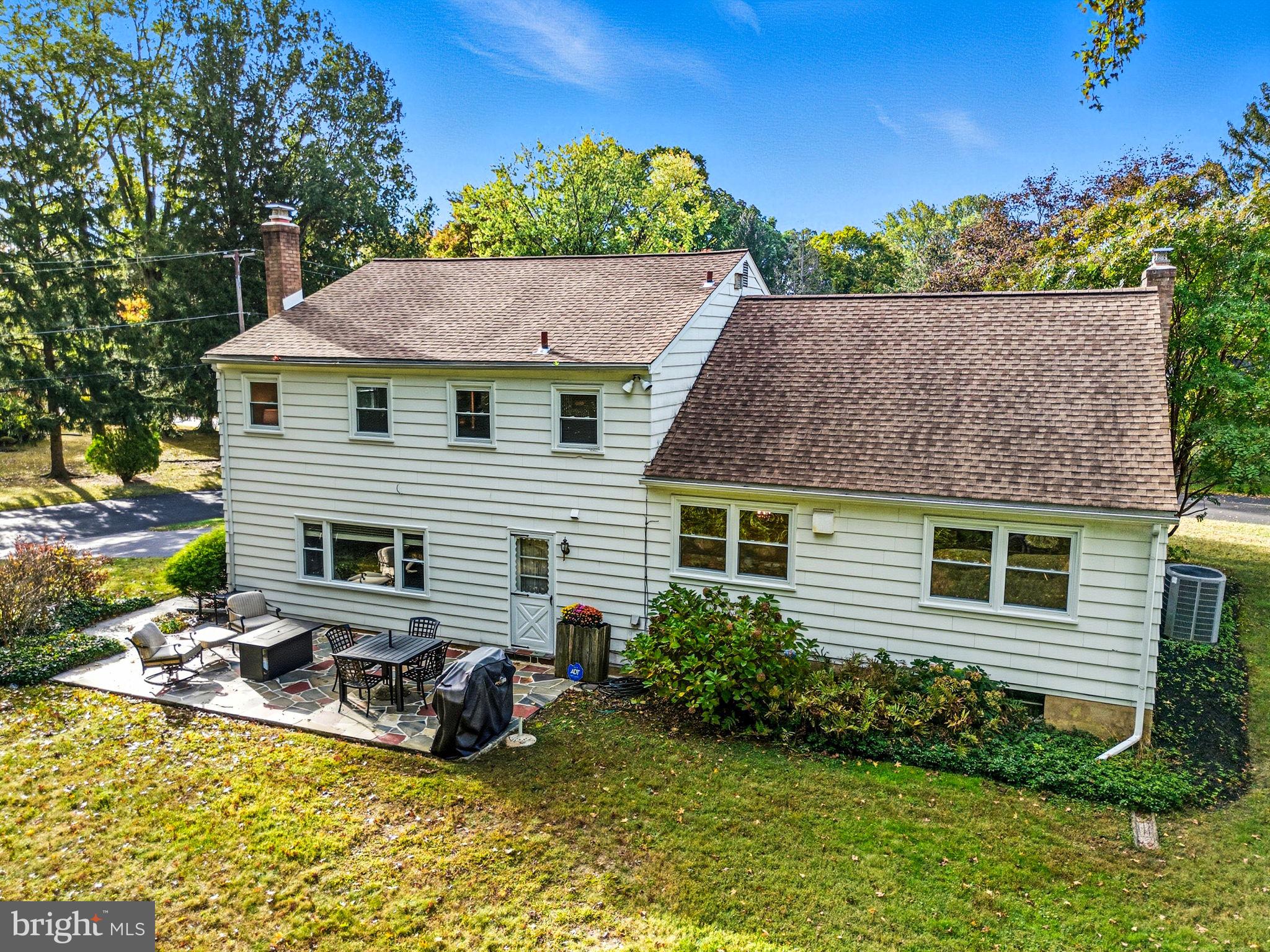 210 Cooper Drive Wallingford, PA 19086 - Photo 38 of 47 a view of a house with pool and chairs