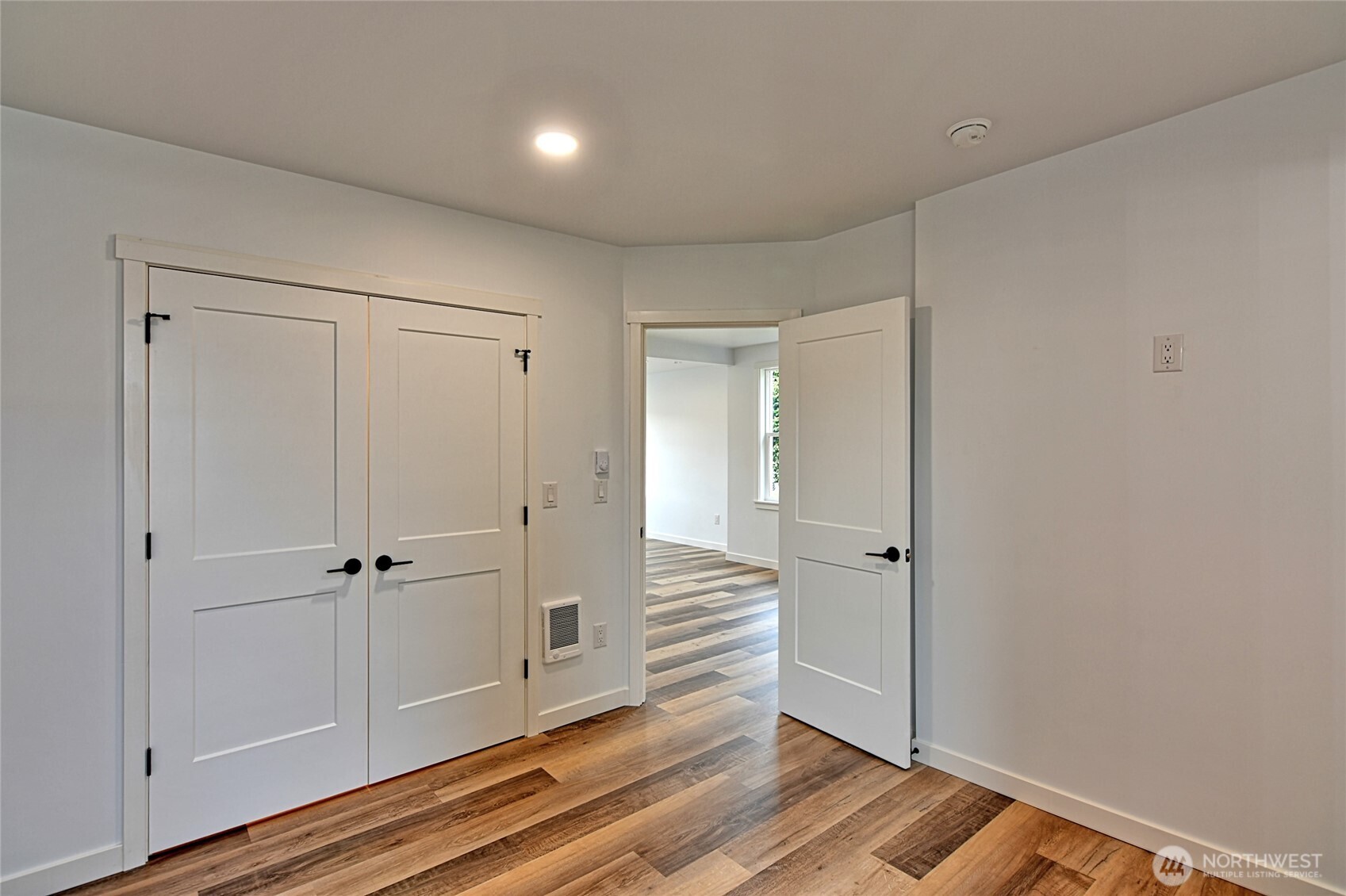 2405 Rockefeller Avenue Everett, WA 98201 - Photo 11 of 17 a view of a hallway with wooden floor