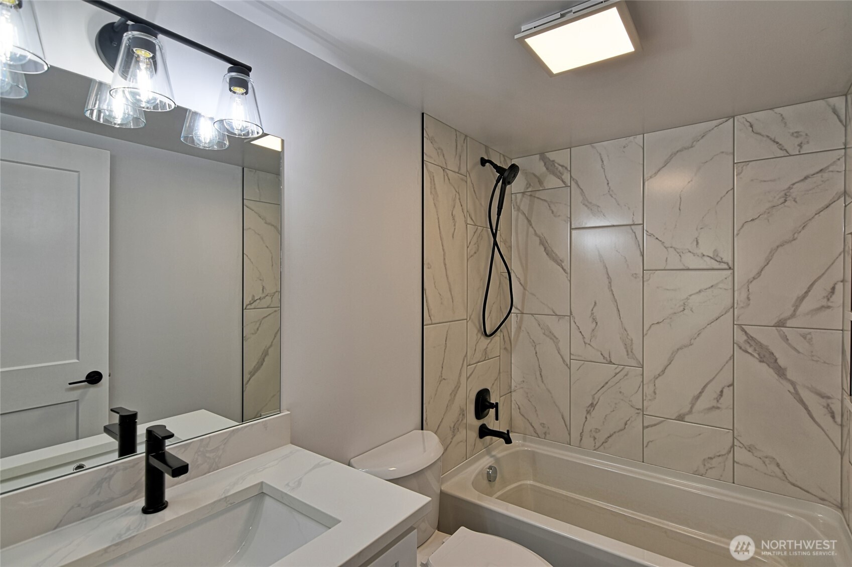 2405 Rockefeller Avenue Everett, WA 98201 - Photo 12 of 17 a bathroom with a sink and a mirror