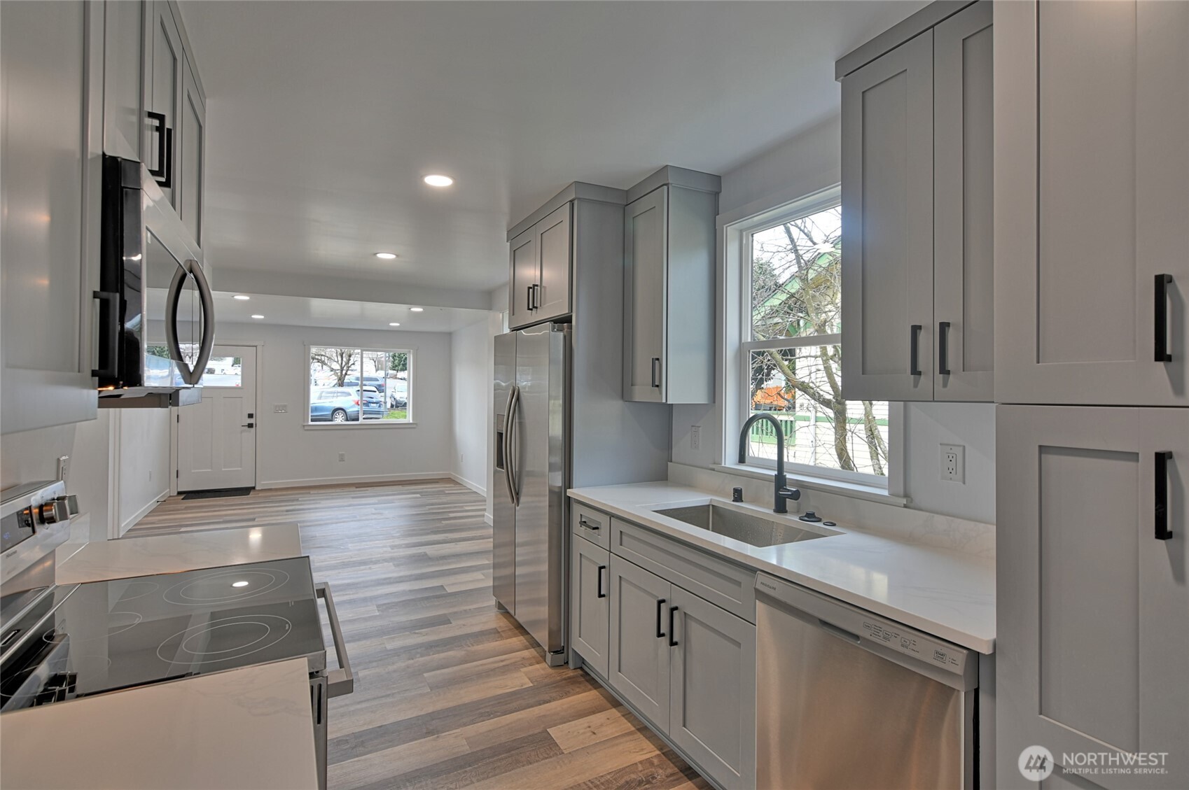 2405 Rockefeller Avenue Everett, WA 98201 - Photo 2 of 17 a bathroom with double vanity sink a two mirror a window and a bathtub