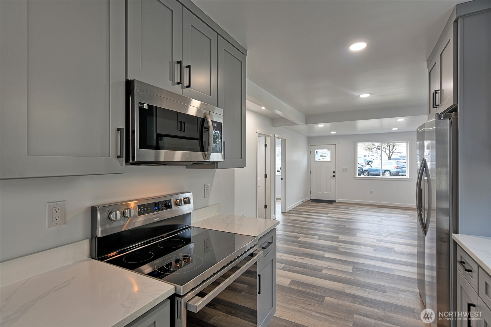 2405 Rockefeller Avenue Everett, WA 98201 - Photo 3 of 17 a kitchen with stainless steel appliances a stove microwave and sink