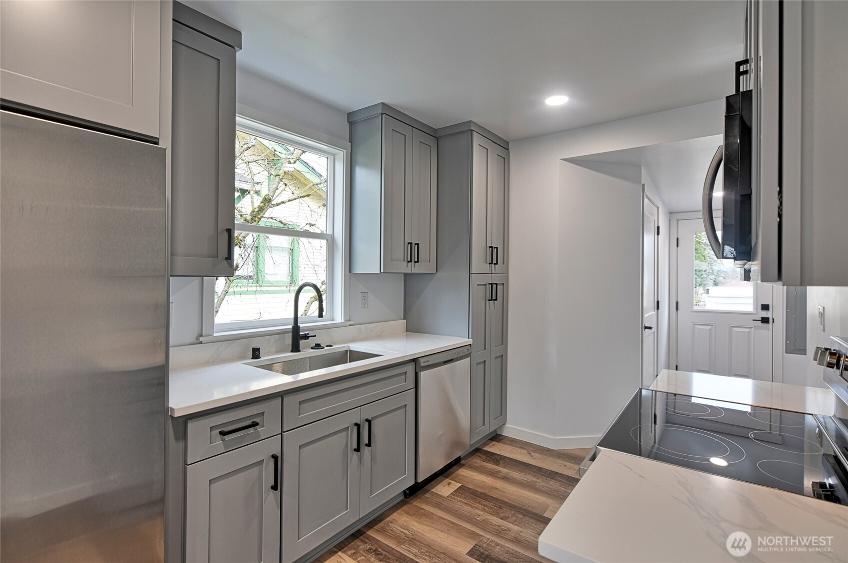 2405 Rockefeller Avenue Everett, WA 98201 - Photo 4 of 17 a spacious bathroom with a double vanity sink a mirror and a shower