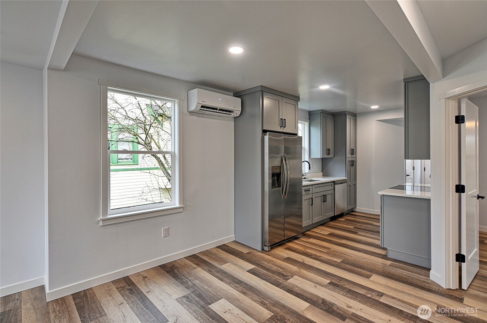 2405 Rockefeller Avenue Everett, WA 98201 - Photo 5 of 17 a kitchen with stainless steel appliances a refrigerator and a stove top oven