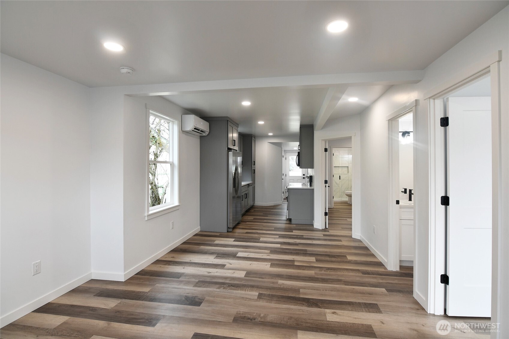 2405 Rockefeller Avenue Everett, WA 98201 - Photo 6 of 17 a view of a hallway with windows and chandelier