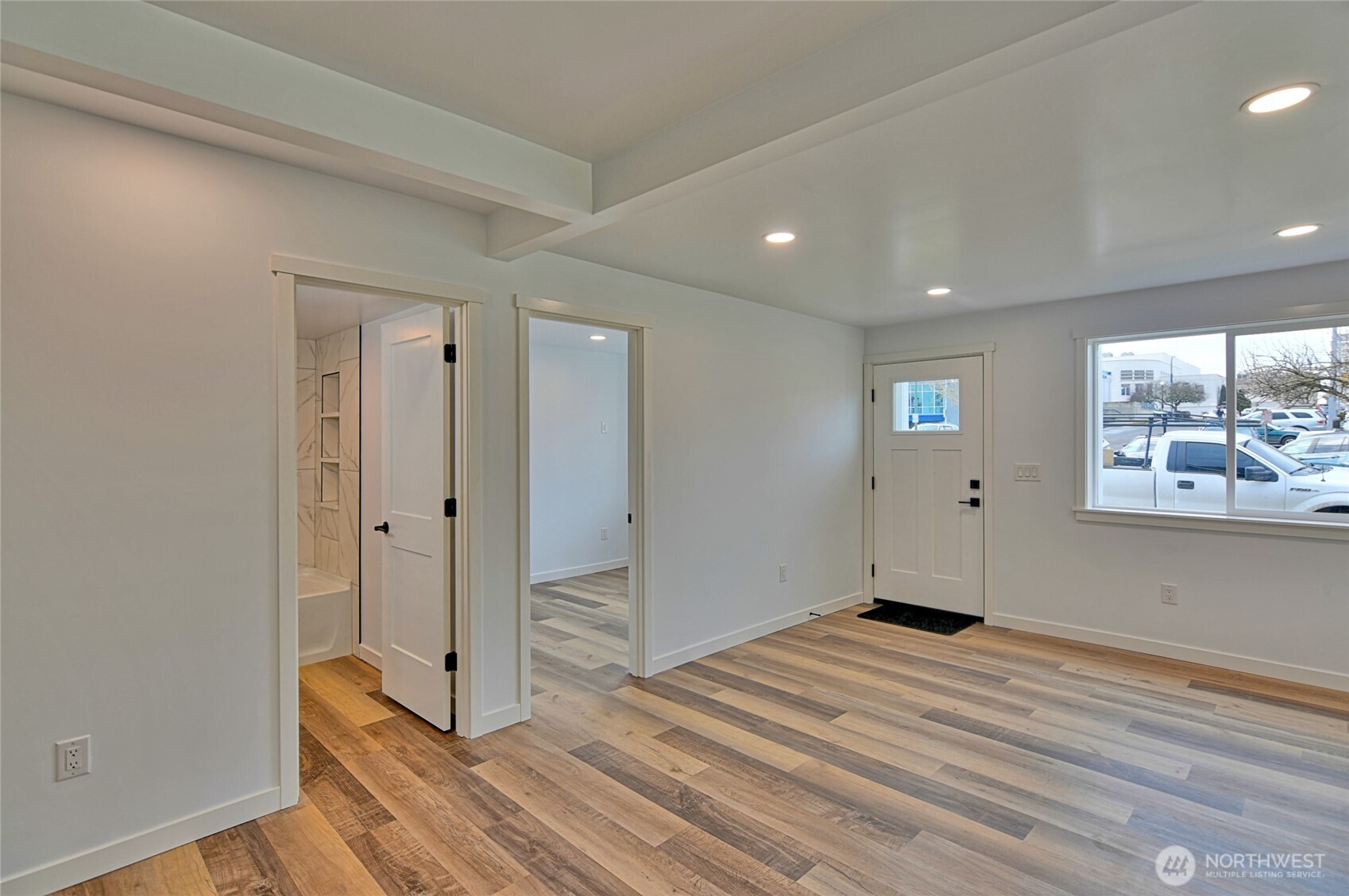 2405 Rockefeller Avenue Everett, WA 98201 - Photo 7 of 17 a view of empty room with window and wooden floor