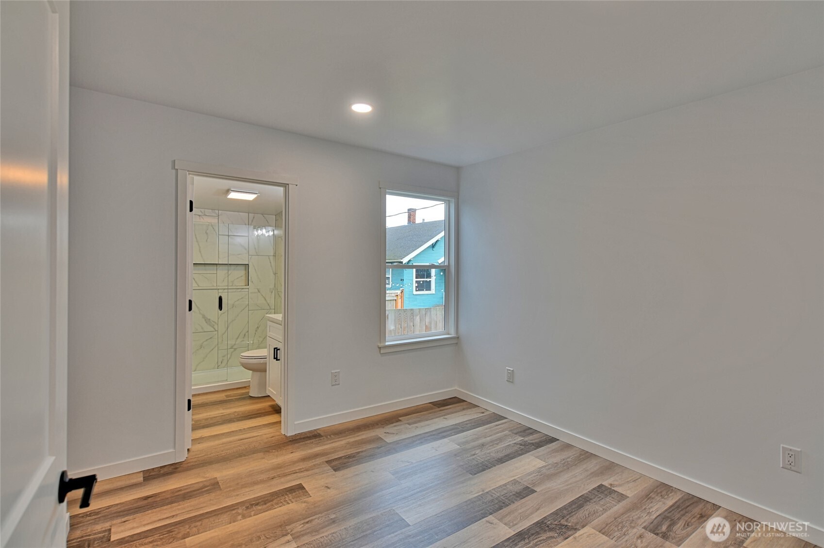 2405 Rockefeller Avenue Everett, WA 98201 - Photo 10 of 17 wooden floor in an empty room with a window