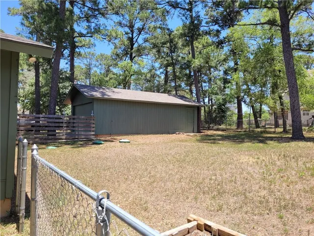 a backyard of a house with lots of green space