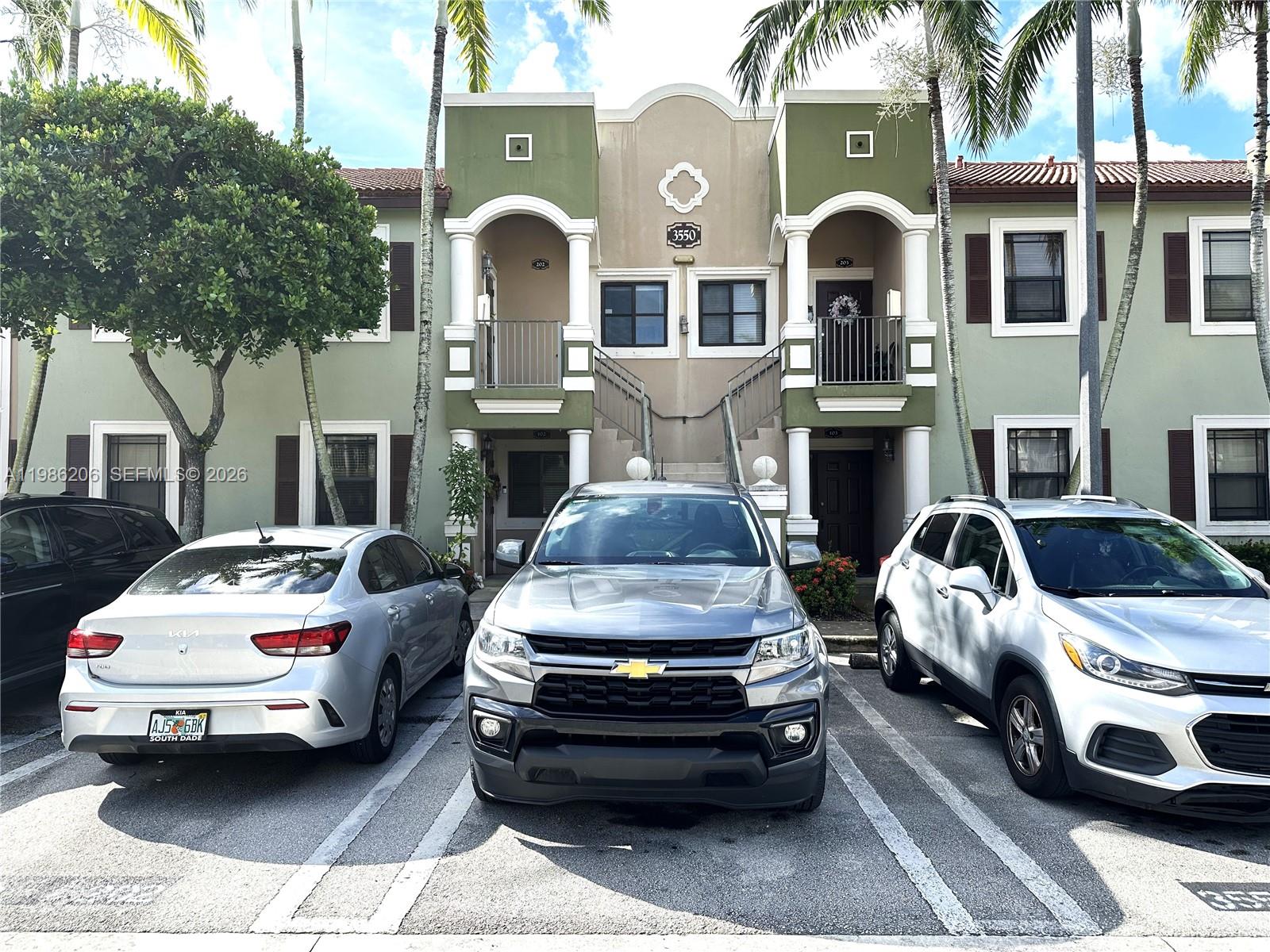 a front view of a house with parking space