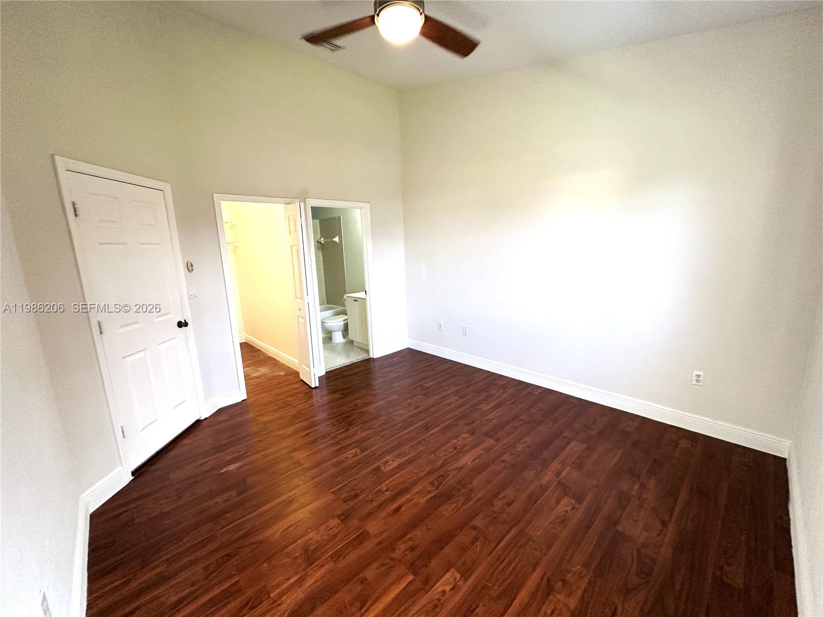 3550 Northeast 5th Street, Unit 202 Homestead, FL 33033 - Photo 16 of 23 wooden floor in an empty room