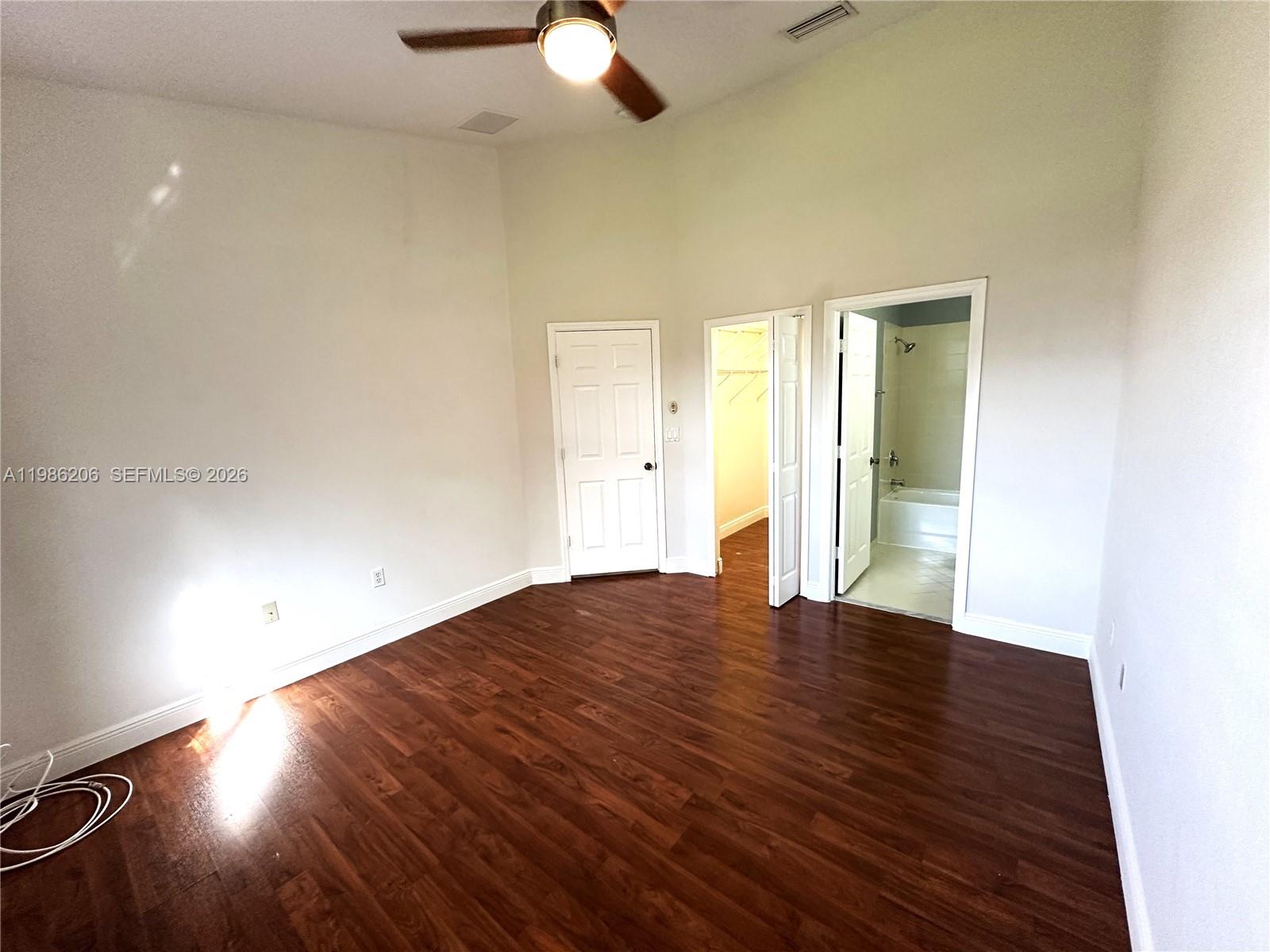 3550 Northeast 5th Street, Unit 202 Homestead, FL 33033 - Photo 17 of 23 wooden floor in an empty room