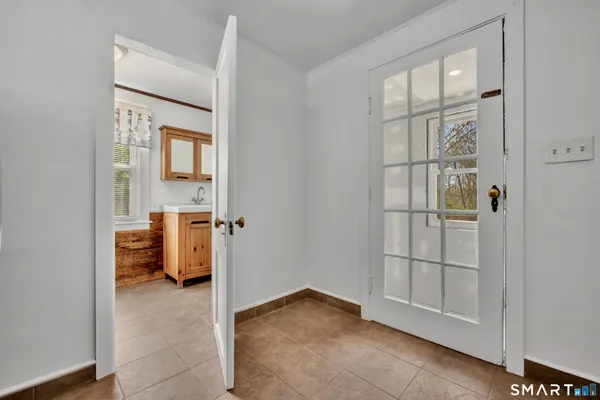 a view of an entryway and livingroom