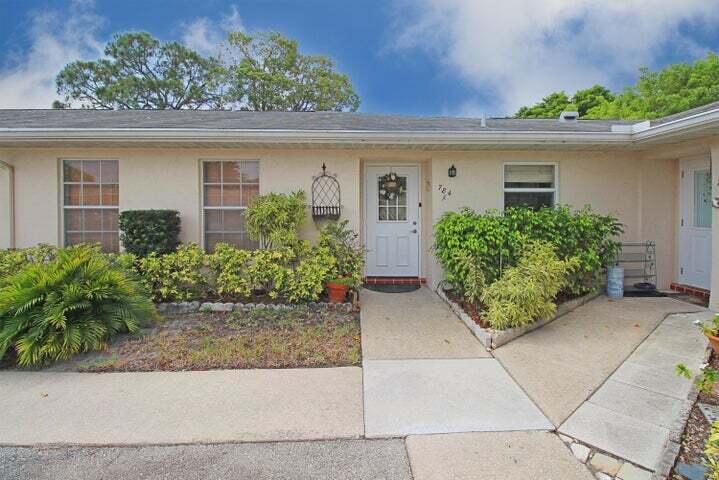 784 Nantucket Circle, Unit A Lake Worth, FL 33467 - Photo 1 of 30 front view of the house with potted plants