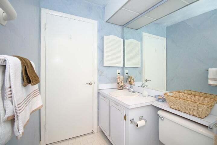 784 Nantucket Circle, Unit A Lake Worth, FL 33467 - Photo 18 of 30 a bathroom with a sink and a mirror