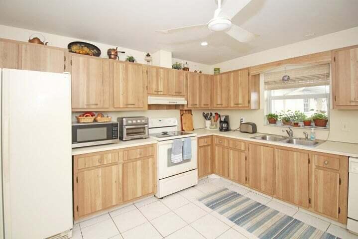 784 Nantucket Circle, Unit A Lake Worth, FL 33467 - Photo 2 of 30 a kitchen with appliances cabinets and a sink