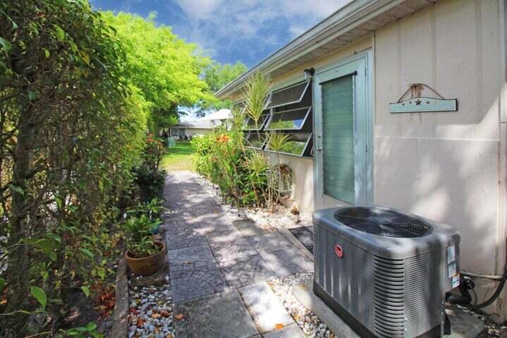 784 Nantucket Circle, Unit A Lake Worth, FL 33467 - Photo 23 of 30 a bathroom with a toilet and a shower