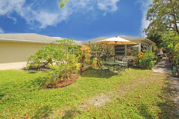 784 Nantucket Circle, Unit A Lake Worth, FL 33467 - Photo 25 of 30 a view of a swimming pool with an outdoor space and seating area