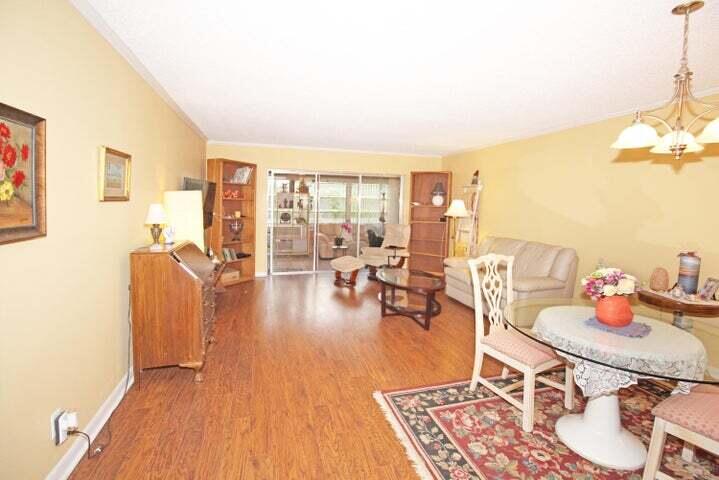 784 Nantucket Circle, Unit A Lake Worth, FL 33467 - Photo 3 of 30 a living room with furniture and a table