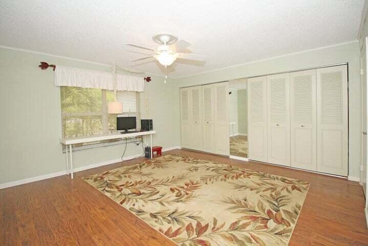 784 Nantucket Circle, Unit A Lake Worth, FL 33467 - Photo 5 of 30 a view of a livingroom with wooden floor and a bathroom