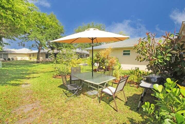 784 Nantucket Circle, Unit A Lake Worth, FL 33467 - Photo 6 of 30 a view of an chairs and table in the patio