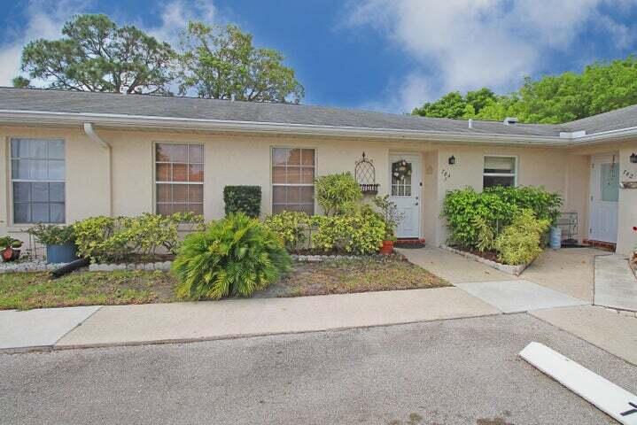 784 Nantucket Circle, Unit A Lake Worth, FL 33467 - Photo 8 of 30 front view of house with a yard