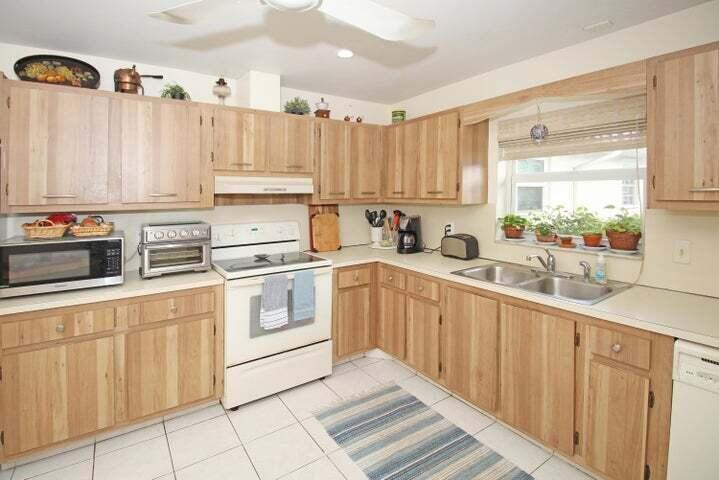 784 Nantucket Circle, Unit A Lake Worth, FL 33467 - Photo 9 of 30 a kitchen with appliances cabinets and a sink