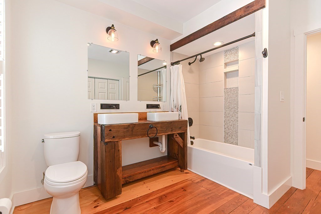 166 Littleton Road, Unit 1 Harvard, MA 01451 - Photo 16 of 23 a bathroom with a sink toilet and shower