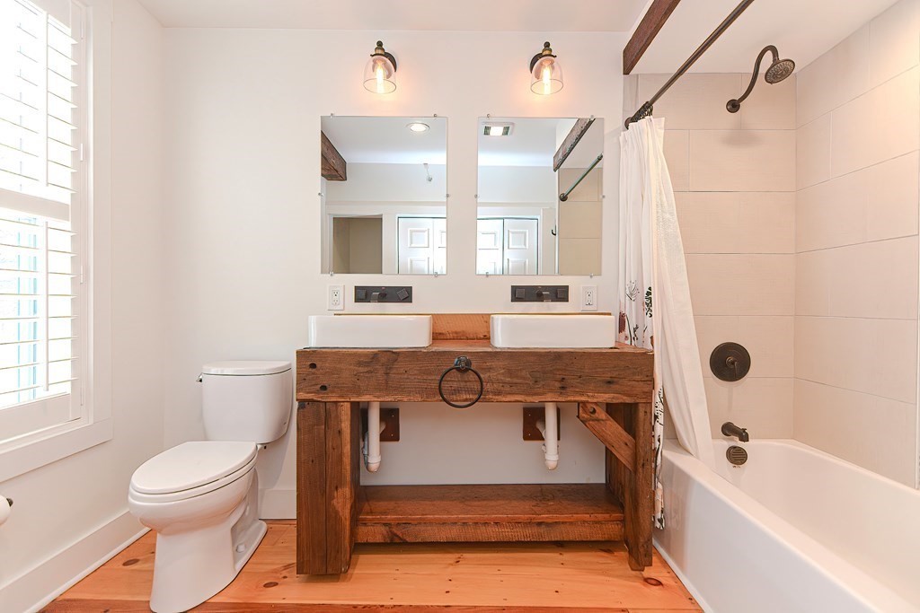 166 Littleton Road, Unit 1 Harvard, MA 01451 - Photo 17 of 23 a bathroom with a sink a toilet and a bathtub