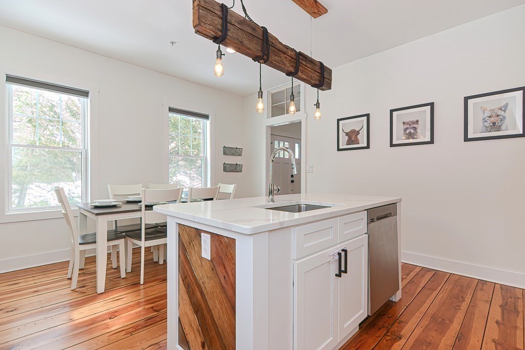 166 Littleton Road, Unit 1 Harvard, MA 01451 - Photo 4 of 23 a view of a kitchen counter space and wooden floor