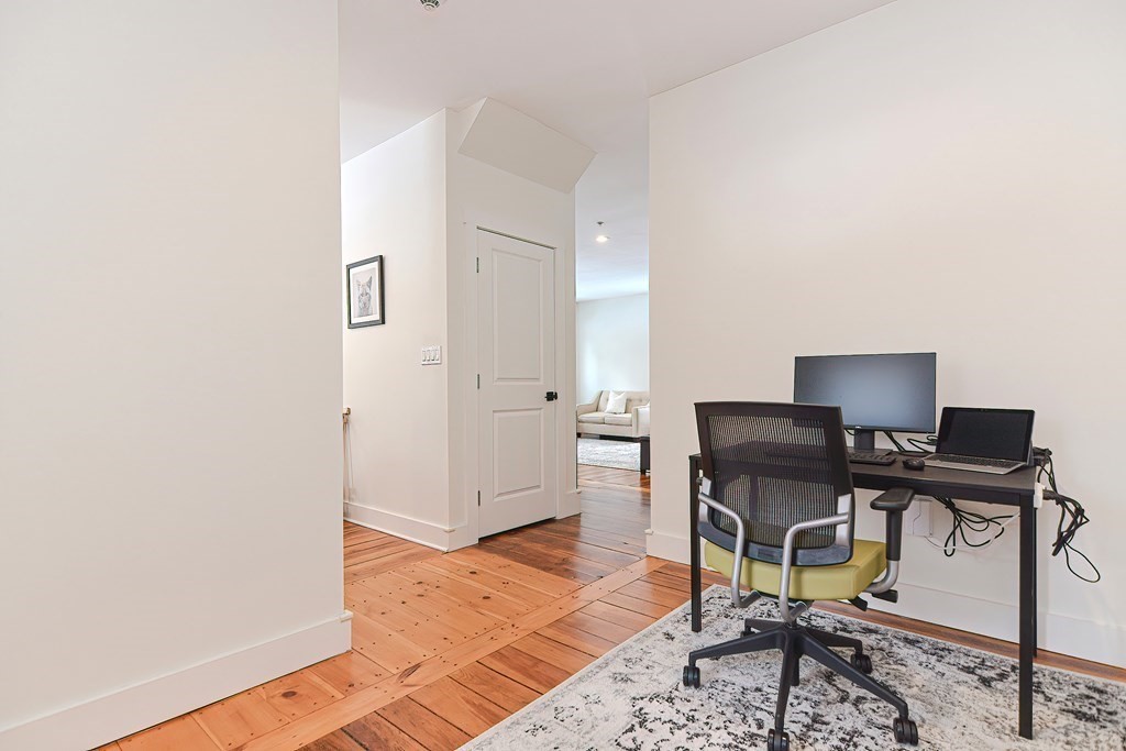 166 Littleton Road, Unit 1 Harvard, MA 01451 - Photo 9 of 23 a workspace with furniture and rug