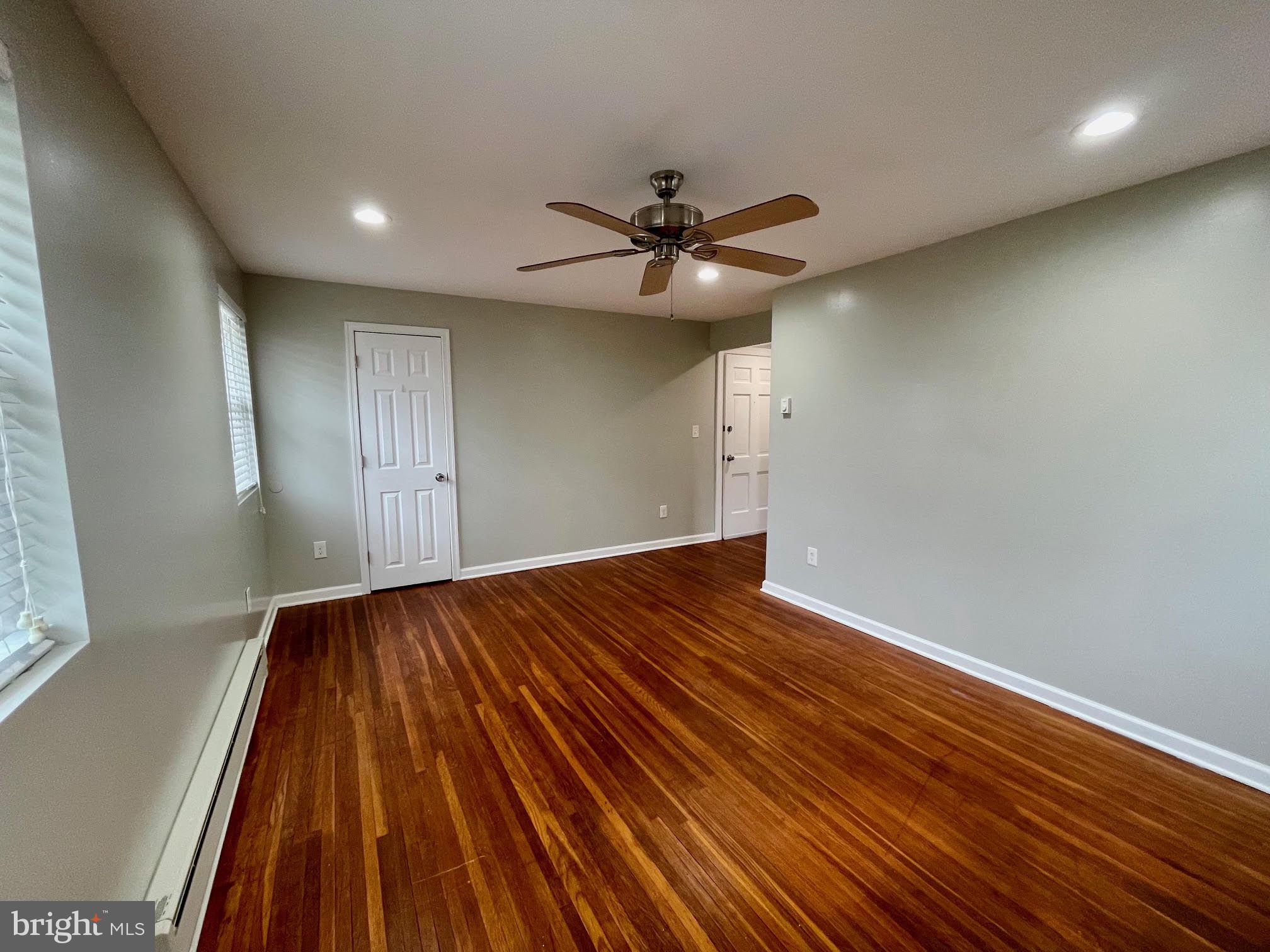 412 East Providence Road Aldan, PA 19018 - Photo 5 of 13 wooden floor in an empty room with a window
