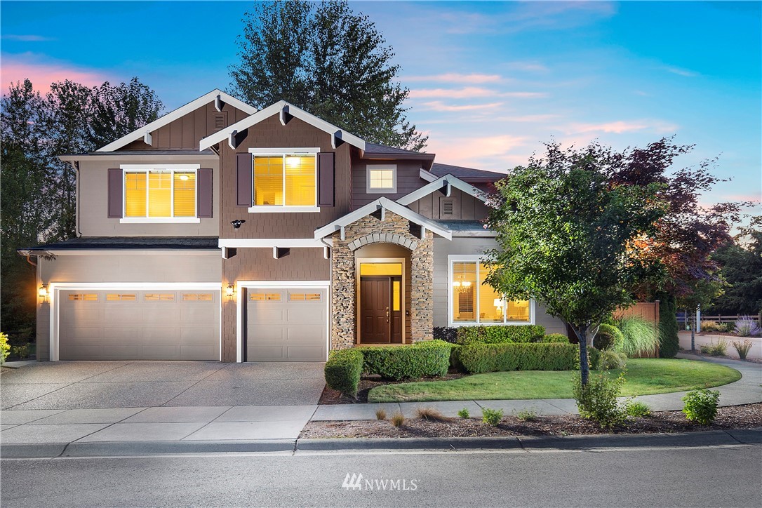 3714 215th Place Southeast Bothell, WA 98021 - Photo 1 of 37 a front view of a house with garden
