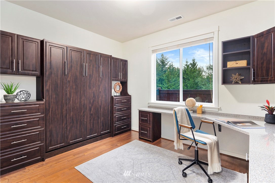 3714 215th Place Southeast Bothell, WA 98021 - Photo 19 of 37 a view of a workspace with furniture and a window