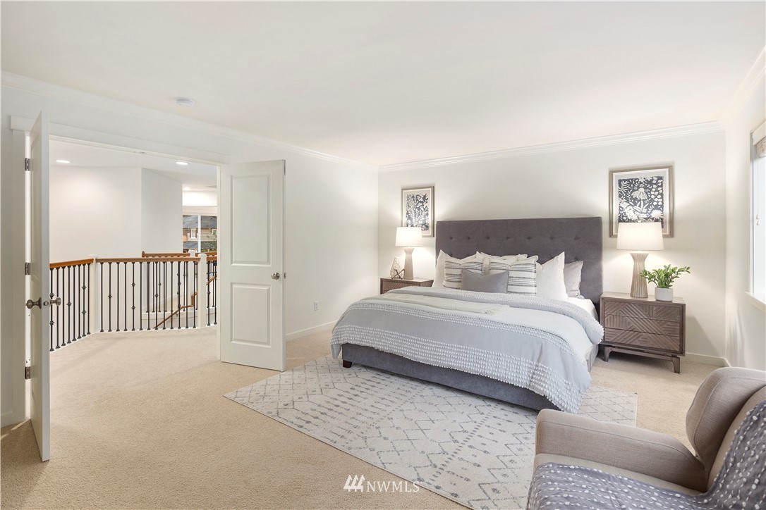 3714 215th Place Southeast Bothell, WA 98021 - Photo 22 of 37 a spacious bedroom with a bed and a couch