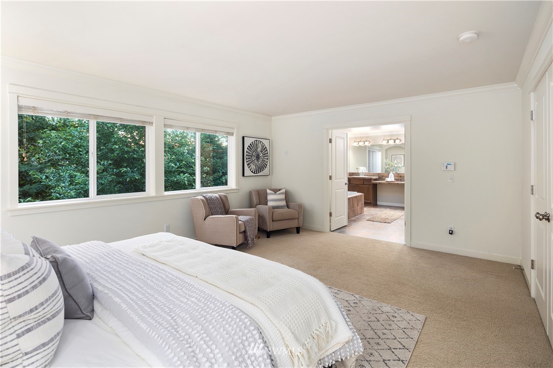 3714 215th Place Southeast Bothell, WA 98021 - Photo 23 of 37 a bedroom with a bed and large windows