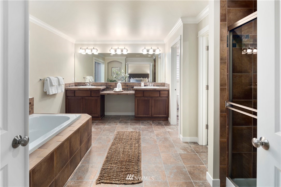 3714 215th Place Southeast Bothell, WA 98021 - Photo 24 of 37 a bathroom with a tub sink and mirror