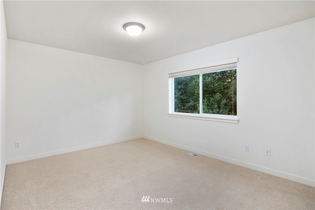 3714 215th Place Southeast Bothell, WA 98021 - Photo 32 of 37 an empty room with a window