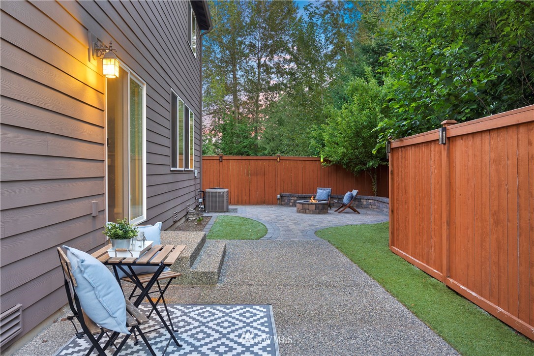 3714 215th Place Southeast Bothell, WA 98021 - Photo 34 of 37 a view of a chair and table in backyard