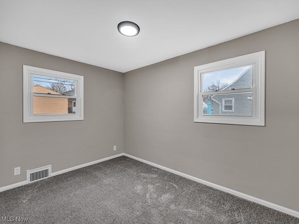 1661 Rush Road Wickliffe, OH 44092 - Photo 14 of 26 Unfurnished room featuring dark carpet