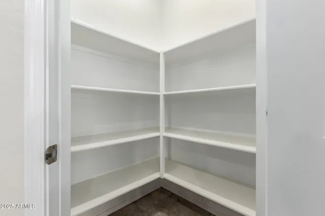 a view of an empty walk in closet